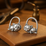 Boucles d'oreilles en argent massif représentant un chiot endormi