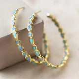 Boucles d'oreilles rétro dorées avec opale bleue