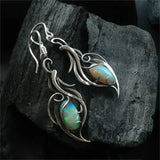 Boucles d'oreilles rétro en argent avec opale bleue