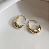 Boucles d'oreilles rétro en forme de croissant doré brillant