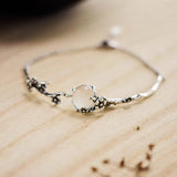 Bracelet en argent rétro avec branche de fleur