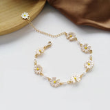 Bracelet rétro avec des marguerites et fleurs blanches