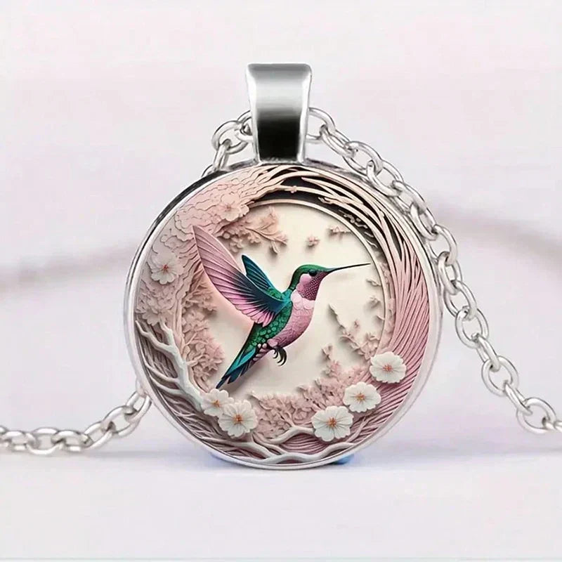 Collier avec pendentif en métal en forme d'hirondelle avec dôme en verre