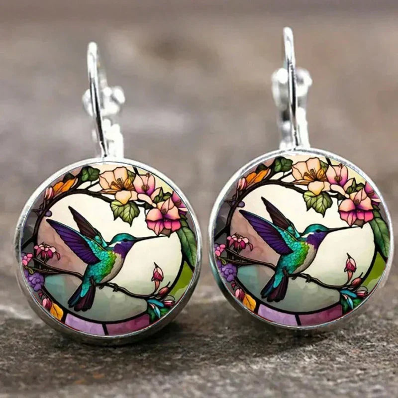 Collier avec pendentif en métal en forme d'hirondelle avec dôme en verre