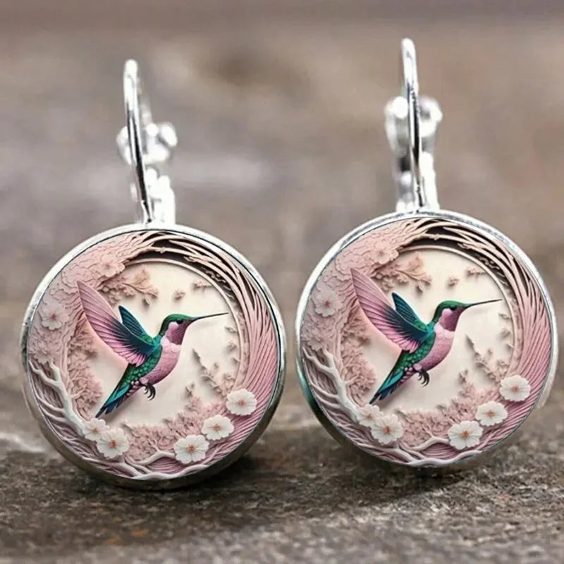 Collier avec pendentif en métal en forme d'hirondelle avec dôme en verre