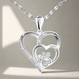 Collier en argent avec patte et cœur en zirconium